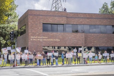 A crowd of protesters demonstrates outside of the Newhall School District office Monday. October 18, 2021. Bobby Block / The Signal.