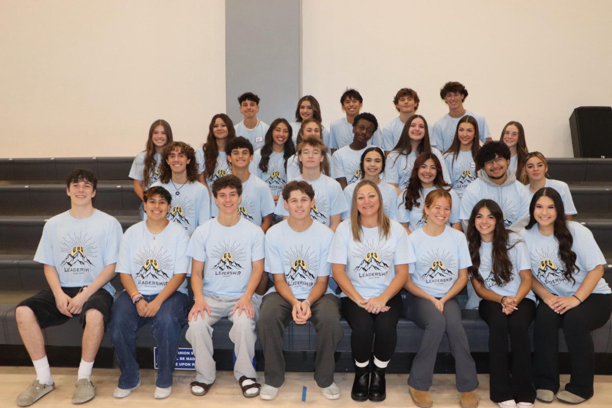Leadership advisor, Mrs. Hanks, Co-Presidents Mia Mendoza (Right of Mrs. Hanks) and Carson Hage (Left of Mrs. Hanks) and the student leaders.