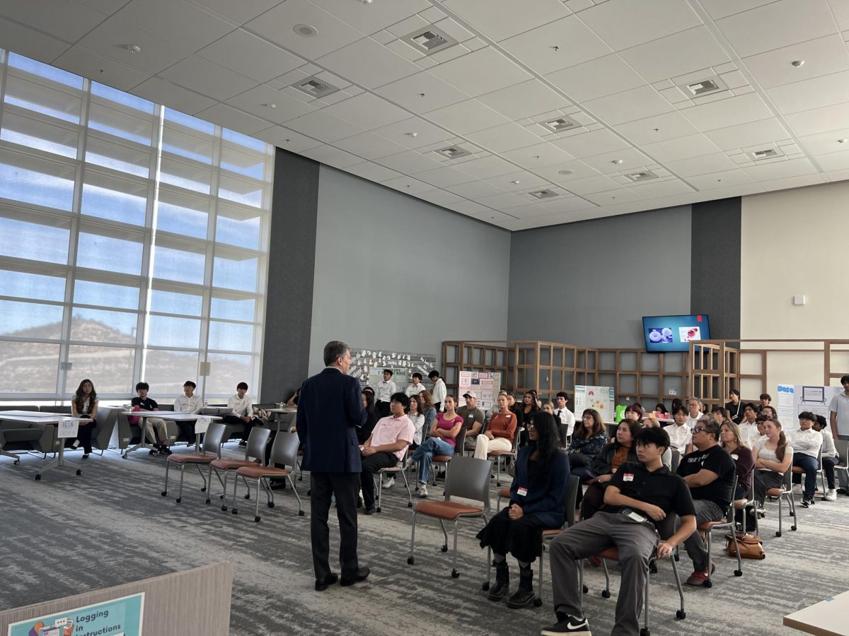 Guest speaker Houman Ferkrazad talking to the audience during the Research in Focus Symposium